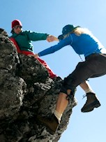 two women rock climbing